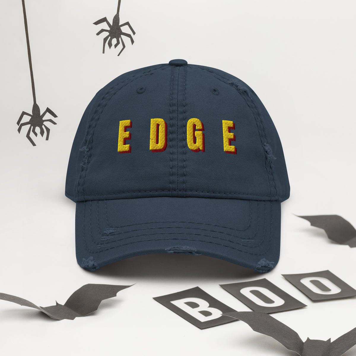 Navy distressed dad hat with yellow and red EDGE embroidered lettering